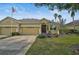 Two-car garage and nicely landscaped front yard at 3312 92Nd E Ave, Parrish, FL 34219