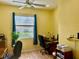 Home office with window, desk, and comfortable chair at 3312 92Nd E Ave, Parrish, FL 34219