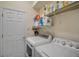 Laundry room with washer, dryer, and shelving at 3312 92Nd E Ave, Parrish, FL 34219