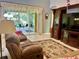 Bright living room with patio access and built-in entertainment center at 3312 92Nd E Ave, Parrish, FL 34219