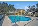 Community pool with lounge chairs and shaded seating area at 3312 92Nd E Ave, Parrish, FL 34219