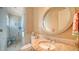 Clean bathroom with a large mirror and a walk-in shower at 3625 Casey Key Rd, Nokomis, FL 34275