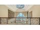 Elegant hallway with ocean views and ornate railing at 3625 Casey Key Rd, Nokomis, FL 34275