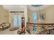 Ocean-view hallway with sitting area and curved railing at 3625 Casey Key Rd, Nokomis, FL 34275