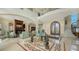 Spacious living area features high ceilings, a marble floor, and a grand staircase at 3625 Casey Key Rd, Nokomis, FL 34275