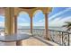 Private balcony overlooking the ocean with seating area at 3625 Casey Key Rd, Nokomis, FL 34275