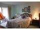 Bright bedroom with double bed and sliding glass door to balcony at 3682 Lake Bayshore Dr # K402, Bradenton, FL 34205