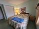 Bedroom with double bed, closet, and nightstand at 3682 Lake Bayshore Dr # K402, Bradenton, FL 34205