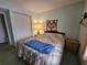 Bedroom with double bed, closet, and nightstand at 3682 Lake Bayshore Dr # K402, Bradenton, FL 34205