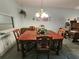 Traditional dining room featuring a wooden table and chairs, ideal for Gathering gatherings and entertaining at 3682 Lake Bayshore Dr # K402, Bradenton, FL 34205