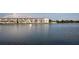 Water view of condominium building on the lake with a dock and serene water feature at 3682 Lake Bayshore Dr # K402, Bradenton, FL 34205