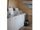 Clean laundry room with several washing and drying machines at 3682 Lake Bayshore Dr # K402, Bradenton, FL 34205