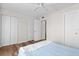 Bedroom with double door closet and wood floors at 4001 Beneva Rd # 208, Sarasota, FL 34233