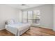 Spacious bedroom with wood floors and large window at 4001 Beneva Rd # 208, Sarasota, FL 34233