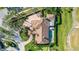 Bird's-eye view of a luxurious home with a pool and large lot at 4201 Palacio Dr, Sarasota, FL 34238