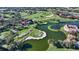 Aerial view of golf course, lake, and community at 4201 Palacio Dr, Sarasota, FL 34238