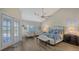 Bright main bedroom with high ceilings, hardwood floors, and access to the patio at 4201 Palacio Dr, Sarasota, FL 34238