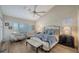 Main bedroom with high ceilings, hardwood floors, and comfortable seating area at 4201 Palacio Dr, Sarasota, FL 34238