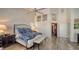 Main bedroom with high ceilings, hardwood floors and ensuite bathroom at 4201 Palacio Dr, Sarasota, FL 34238