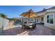 Outdoor patio with pool, seating area, and umbrella at 4201 Palacio Dr, Sarasota, FL 34238