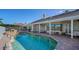 Resort-style pool with a waterfall feature and patio at 4201 Palacio Dr, Sarasota, FL 34238