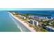 Aerial of beachfront community, showcasing ocean and bay views at 4310 Falmouth Dr # A104, Longboat Key, FL 34228