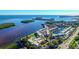 Aerial view of a waterfront community with lush landscaping and a pool at 4310 Falmouth Dr # A104, Longboat Key, FL 34228