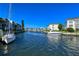 Boats docked along a peaceful canal; serene waterfront living at 4310 Falmouth Dr # A104, Longboat Key, FL 34228