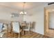 Dining area with hardwood floors and granite table at 4310 Falmouth Dr # A104, Longboat Key, FL 34228