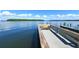 Community dock with a bench overlooking the peaceful water at 4310 Falmouth Dr # A104, Longboat Key, FL 34228