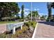 Community entrance with landscaping and a Longboat Harbour sign at 4310 Falmouth Dr # A104, Longboat Key, FL 34228