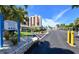 Private property parking lot with ample spaces and gated entrance at 4310 Falmouth Dr # A104, Longboat Key, FL 34228