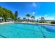 Inviting community pool with lush landscaping and waterfront views at 4310 Falmouth Dr # A104, Longboat Key, FL 34228