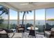 Bright sunroom with water views and comfortable seating at 4310 Falmouth Dr # A104, Longboat Key, FL 34228