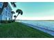 Peaceful waterfront view with a paved walkway and lush landscaping at 4310 Falmouth Dr # A104, Longboat Key, FL 34228