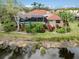 Aerial view showcasing the home's backyard and lake at 4539 Longspur Ln, Sarasota, FL 34238