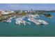 Aerial view of a marina with numerous boats and a city skyline in the background at 4539 Longspur Ln, Sarasota, FL 34238