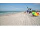 Relaxing beach scene with lifeguard and clear water at 4539 Longspur Ln, Sarasota, FL 34238