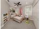 Charming bedroom with canopy bed and built-in shelving at 4539 Longspur Ln, Sarasota, FL 34238