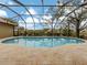 Inviting kidney-shaped pool with screened enclosure at 4539 Longspur Ln, Sarasota, FL 34238