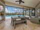 Relaxing pool area with patio furniture and screened enclosure at 4539 Longspur Ln, Sarasota, FL 34238