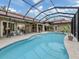 Relaxing pool and patio with screened enclosure at 4539 Longspur Ln, Sarasota, FL 34238