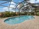 Stunning kidney-shaped pool with screened enclosure at 4539 Longspur Ln, Sarasota, FL 34238