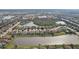 Aerial view of houses around a lake in a residential community at 4629 Garden Arbor Way, Bradenton, FL 34203