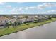 Aerial view of lakefront houses with lush landscaping at 4629 Garden Arbor Way, Bradenton, FL 34203