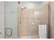 Shower with glass doors and tiled walls at 4629 Garden Arbor Way, Bradenton, FL 34203