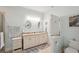 Double vanity bathroom with granite countertops and a toilet at 4629 Garden Arbor Way, Bradenton, FL 34203