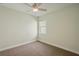 Simple bedroom with ceiling fan and carpeted floor at 4629 Garden Arbor Way, Bradenton, FL 34203