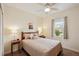 Cozy bedroom with a queen-size bed and a window with a view at 4629 Garden Arbor Way, Bradenton, FL 34203