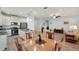 Open concept dining area with adjacent kitchen and living room at 4629 Garden Arbor Way, Bradenton, FL 34203